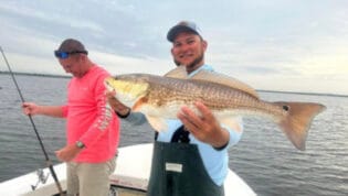 Capt. Jared holding redfish