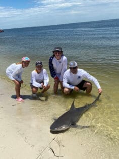 Family charter with shark catch