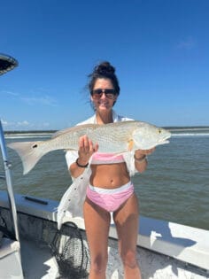 Girl with Redfish Catch