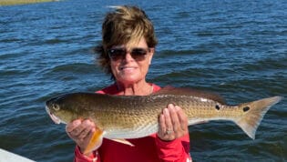 Lady holding redfish